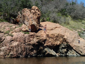 Cliff jumpers at Devil's Waterhole